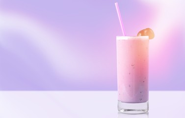 Glass of delicious berry cocktail on perple background