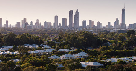 Telephoto shot of Surfer Paradise skyline with golfing village in foreground.