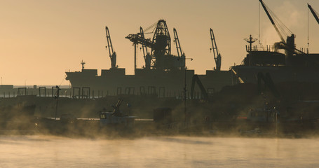 Busy harbour in Portland, Victoria, Australia at sunrise.