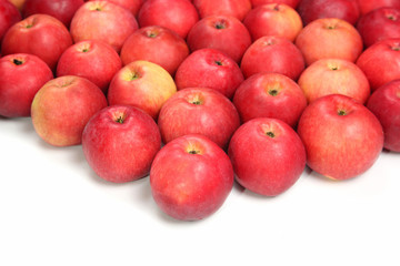 Fototapeta na wymiar Lots of red apples on white background