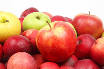 Lots of red apples on white background