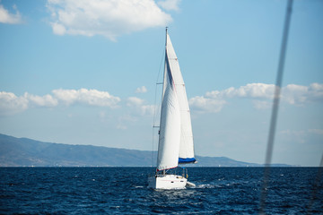 Fototapeta premium Sailboat participate in sailing yachts regatta among Greek island group in the Aegean Sea.