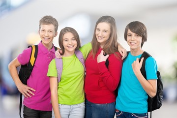 Friendly school children with backpacks concept