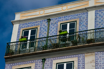 Fototapeta na wymiar Old building facade with Lisbon traditional tiles. Lisbon, Portugal