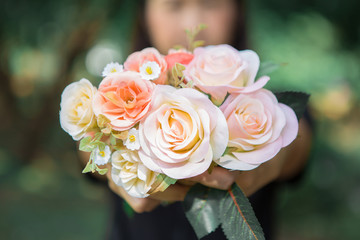 Woman holding a bouquet of roses