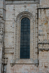 Fototapeta na wymiar Jeronimos Monastery or Hieronymites Monastery window (Mosteiro dos Jeronimos) Portuguese Late Gothic Manueline style of architecture. Belem, Lisbon. Portugal
