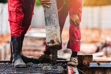 Construction men worker control boom concrete