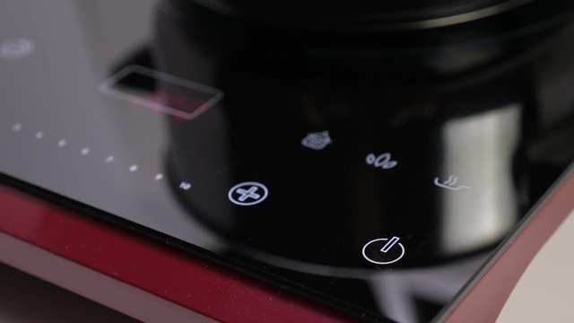 Switch on Induction stove and set power of heating