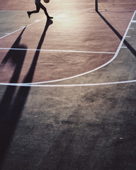 Shadow of Boy Playing Basketball