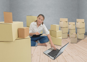 teenager owner business woman work at home with Clipboard, laptop for online shopping writing the order