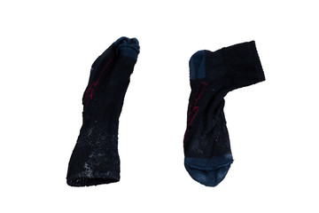 Old black socks dumped on the soil.