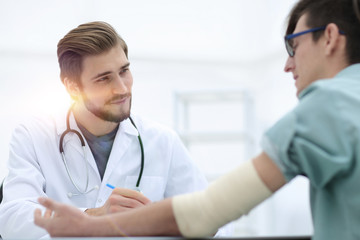 Fototapeta premium doctor writing a prescription to her patient,