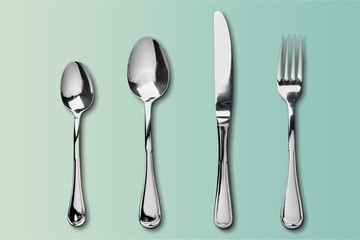 Fork, spoon and knife on blue background