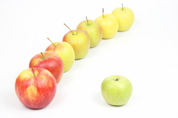 Green Apple next to other apples on white background