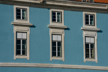 Fototapeta na wymiar Old building facade windows. Lisbon, Portugal.