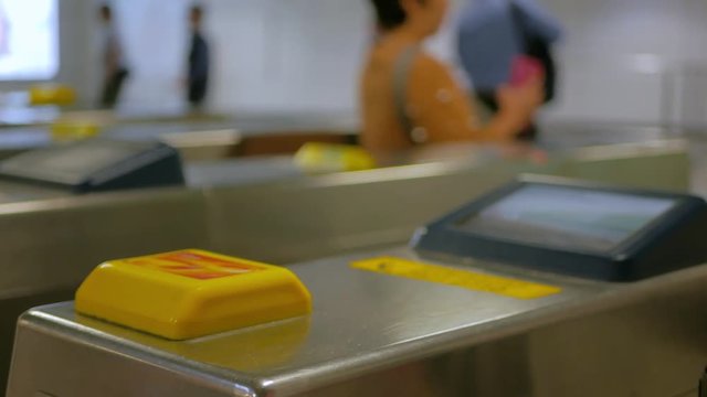 Girl using RFID octopus card in Hong Kong subway MTR