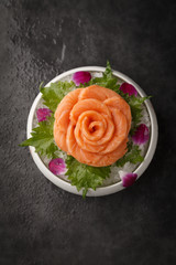 Obraz na płótnie Canvas Salmon sashimi in the shape of a rose