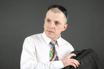 business man with a briefcase looking to the side