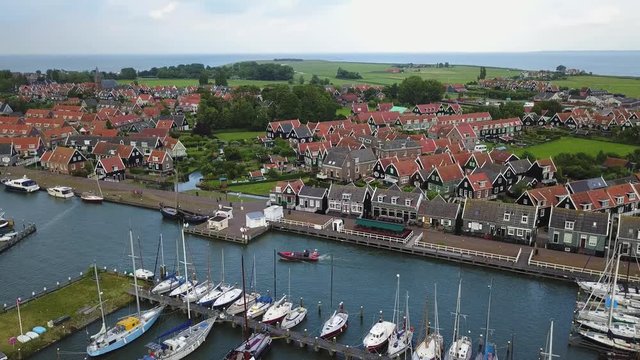 Panning aerial shot above the harbor in the town of Marken in the Netherlands