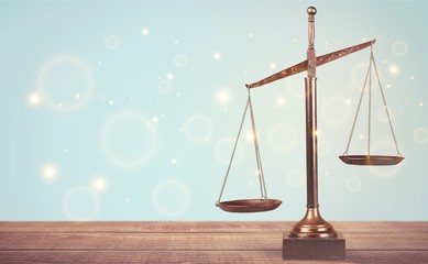 Law scales on table background. Symbol of justice