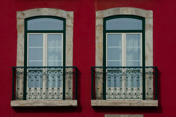 Old Building facade with two windows in Lisbon, Portugal