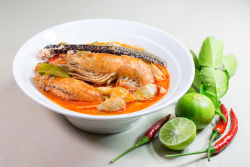 River prawn spicy soup (Tom yum koong) Thai food and ingredient vegetable