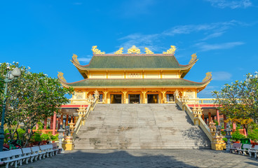 Fototapeta premium Vung Tau, Vietnam - September 30th, 2018: Architecture presbytery temple Dai Tong Lam afternoon sunshine, which attracts tourists to visit spiritually and relax soul on weekends in Vung Tau, Vietnam