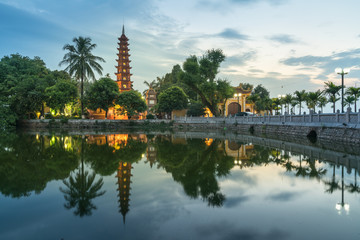 Fototapeta na wymiar Tran Quoc pagoda during sunset time, the oldest temple in Hanoi, Vietnam. Hanoi cityscape.