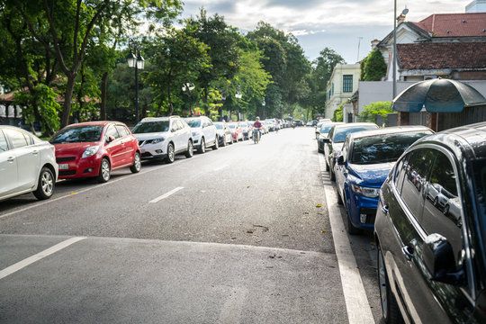Parallel parking cars on urban street. Outdoor parking on road