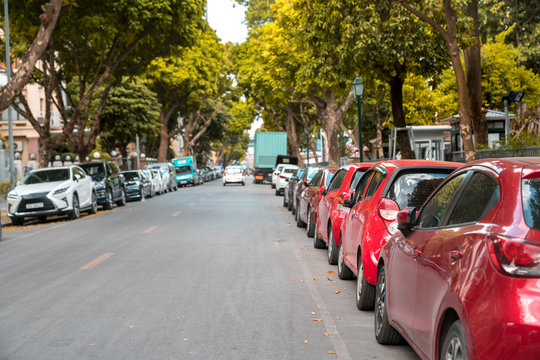 Parallel parking cars on urban street. Outdoor parking on road