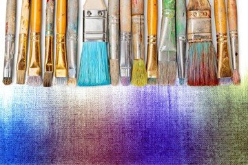 Row of artist paint brushes  on background