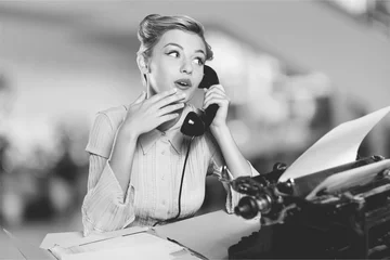 Fototapeten Attractive young woman speaking on  vintage phone © BillionPhotos.com