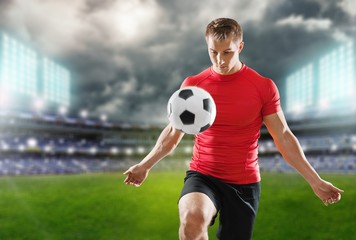 Man hand holding football ball on background