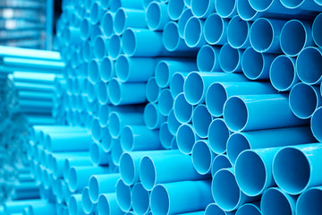 Blue PVC pipes stacked