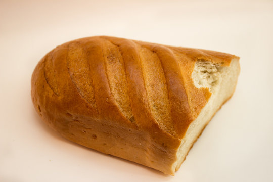half delicious soft bread on white background