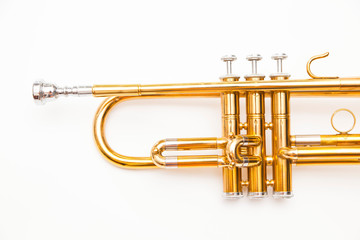 Close up of trumpet on white background. Detail of old trumpet instrument.