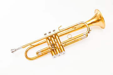 Close up of trumpet on white background. Detail of old trumpet instrument.