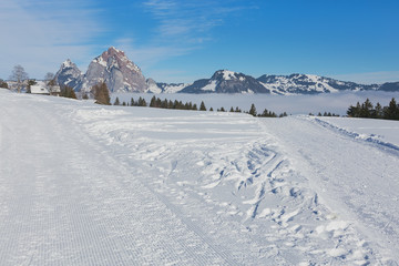 View from the village of Stoos in the Swiss canton of Schwyz in winter, Kleiner Mythen and Grosser Mythen summits in the background