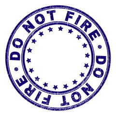 DO NOT FIRE stamp seal watermark with distress texture. Designed with circles and stars. Blue vector rubber print of DO NOT FIRE text with corroded texture.