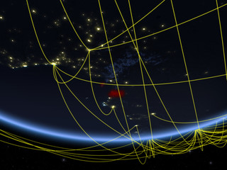 Equatorial Guinea on model of planet Earth at night with network representing travel and communication.