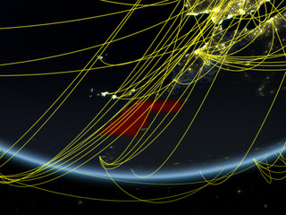 Western Sahara on model of planet Earth at night with network representing travel and communication.