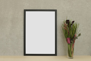 Black modern photo frame isolated on wooden table