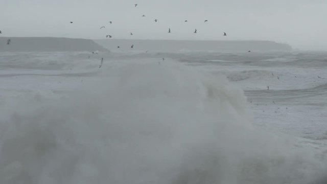 Huge waves off the coast of Cornwall in February two thousand and fourteen