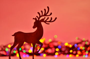 Christmas background with deer silhouette.