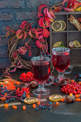 hot drink, spices in autumn decorations - grog, mulled wine, punch, hot tea with orange