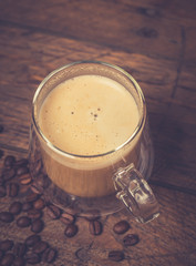 Cup of Cappuccino on wooden vintage table
