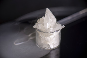 Fototapeta na wymiar Cannabidiol crystal aka CBD, medical marijuana background