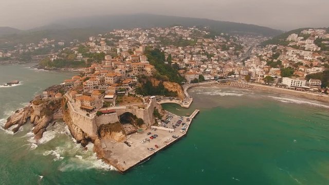 Beautiful drone shot flying along the coast of the city of Ulcinj, Montenegro