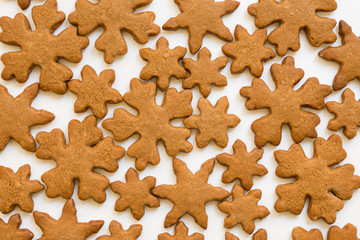 Christmas cookies in the shape of snowflakes handmade basic for your decoration on the white background