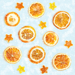 Christmas background of dried oranges, orange peel in the shape of a star. Seamless background